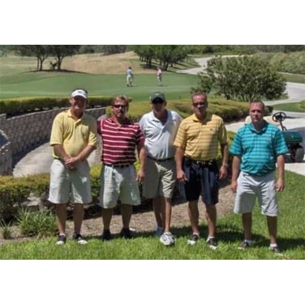 Four Golfers With Caddie Bobby at Medalist Golf Club